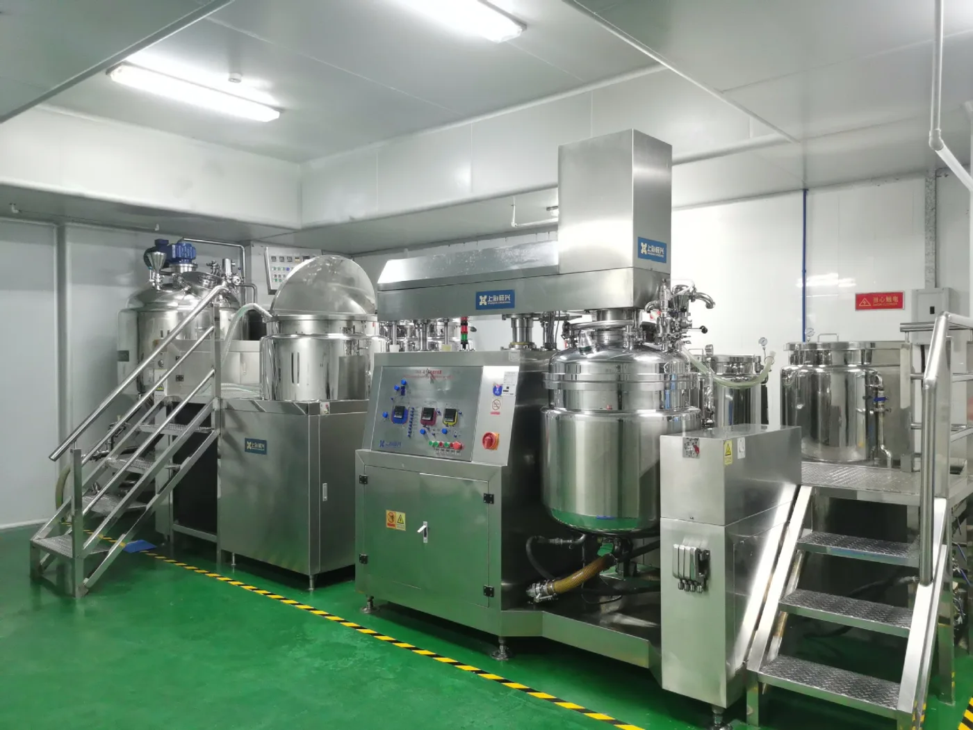 Stainless-steel perfume compounding equipment in the factory workshop