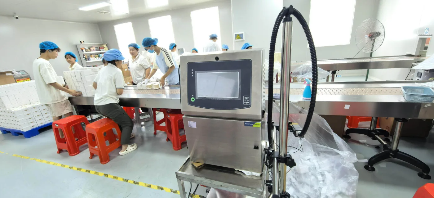 Production team conducting packaging and quality inspection